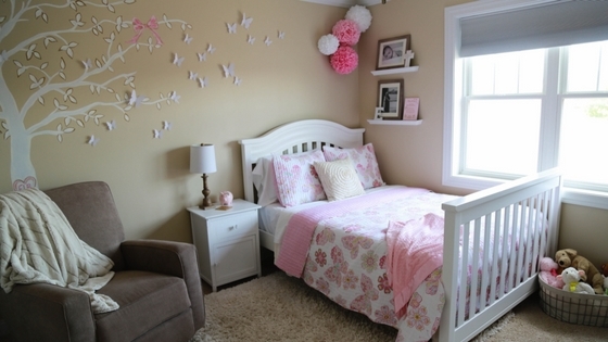 twin bed and crib in small room